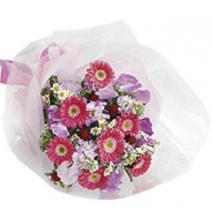 Bouquet from gerberas camomiles in pink colours
