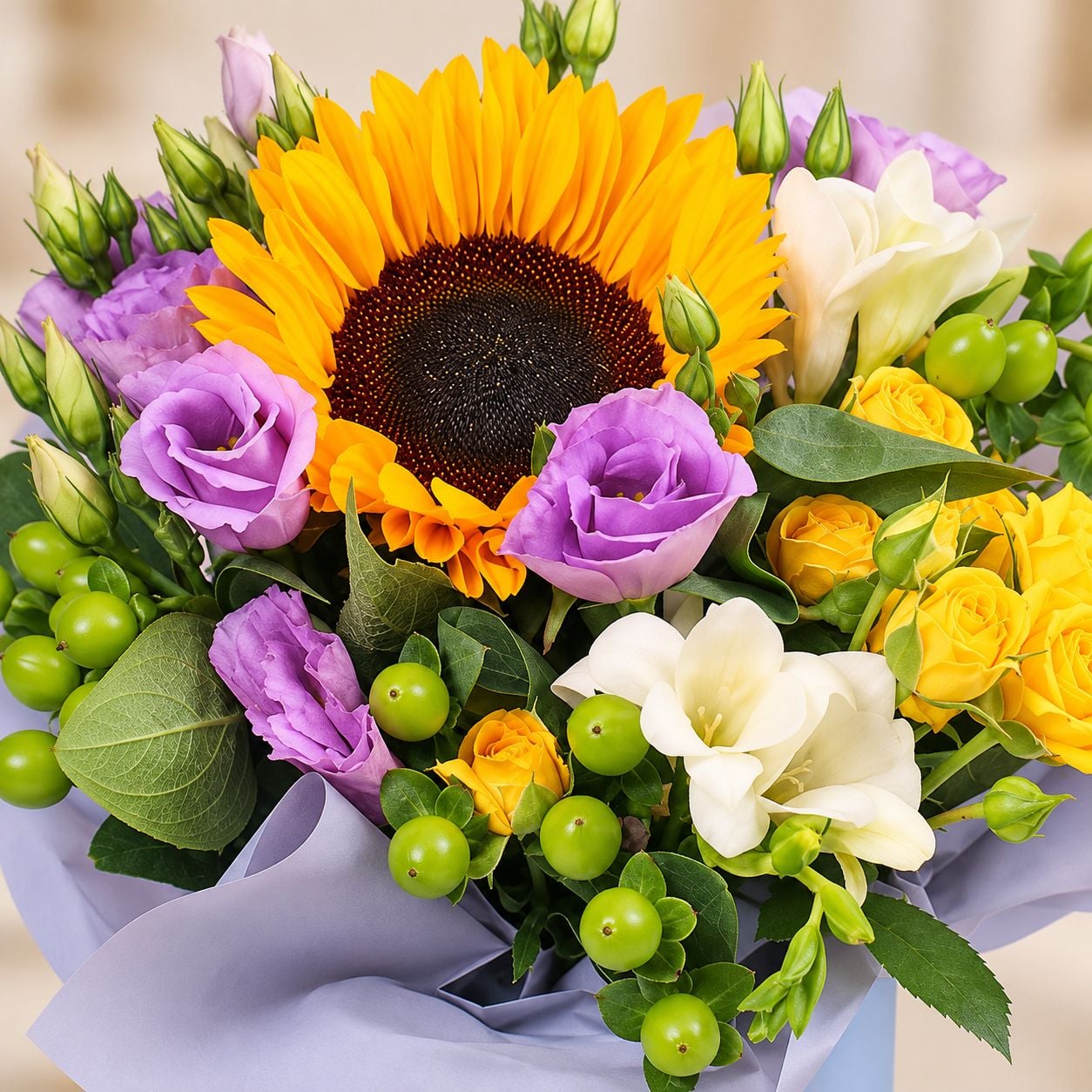 sunflower, eustoma (3 pcs.), freesia (2 pcs.), hypericum, oasis, spray rose, packaging, ribbon