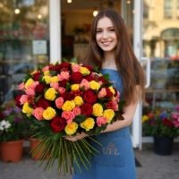 hypericum (10 pcs.), red rose (35 pcs.), coral rose (35 pcs.), yellow rose (31 pcs.), packaging, ribbon