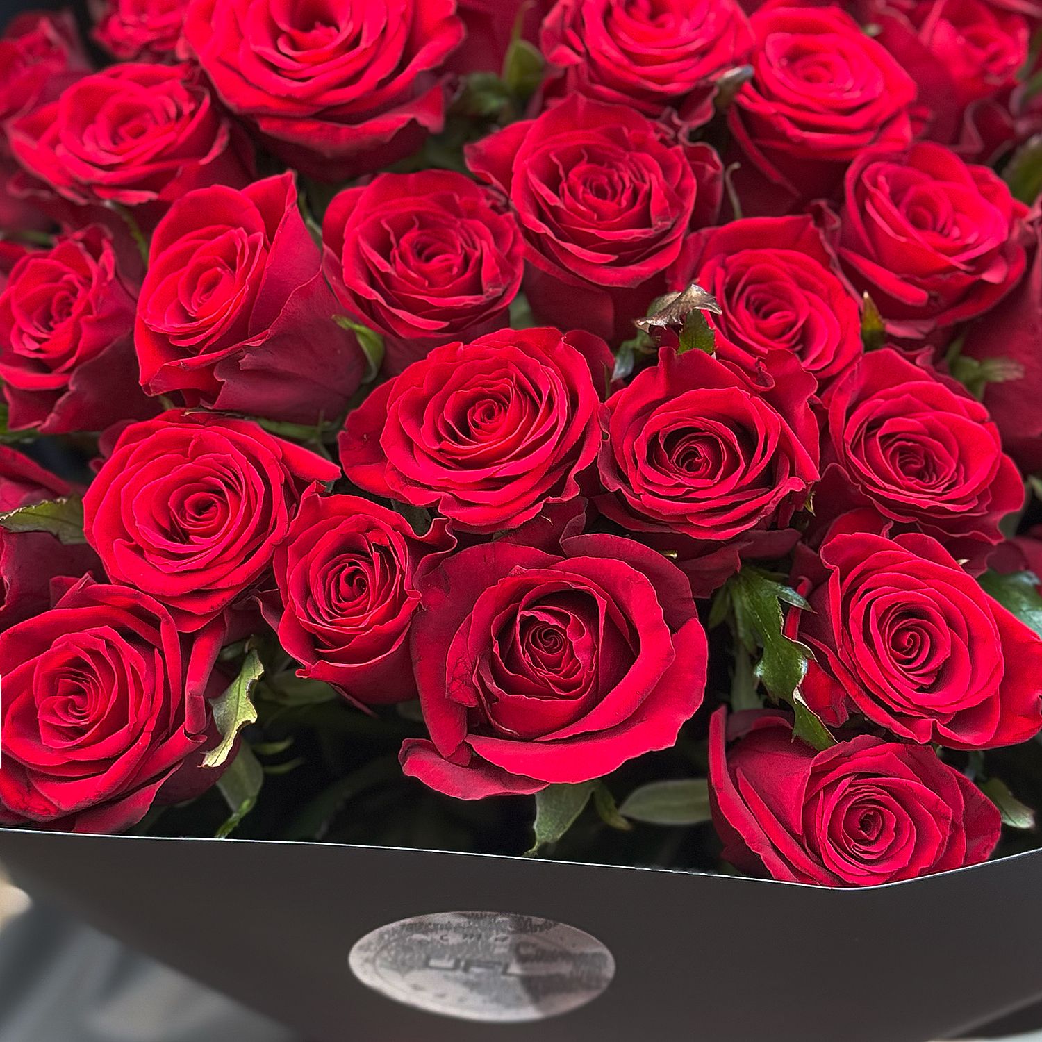Bouquet 51 red roses in black wrapping