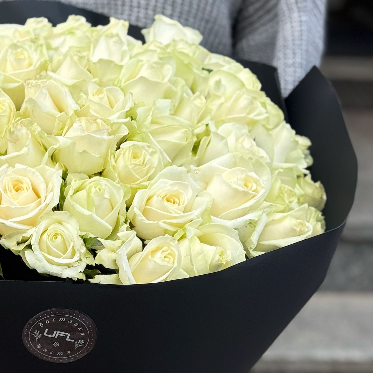 Bouquet 51 white roses in black wrapping
