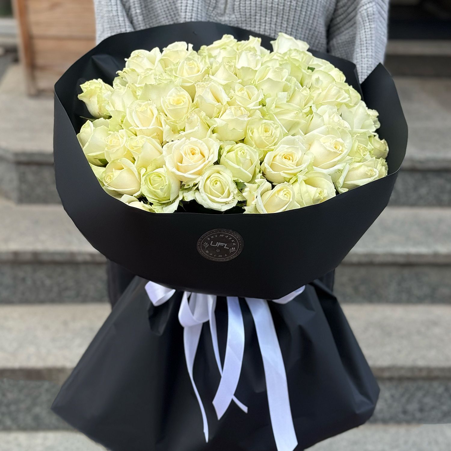 Bouquet 51 white roses in black wrapping