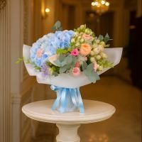 hydrangea, calla (3 pcs.), spray roses (3 pcs.), trachelium, freesia (3 pcs.), vuvuzela rose, packaging, ribbon